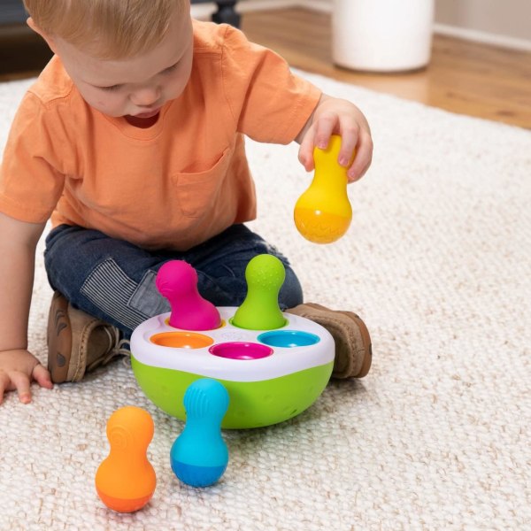 Fat Brain Spinny Pins Baby tumbling bowling pins to put away