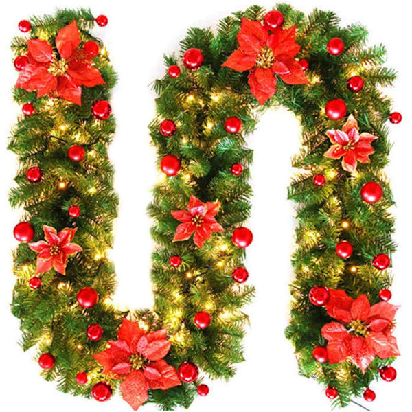 Juleguirlande dekoration med lys, kunstige juleplanter i rotting
