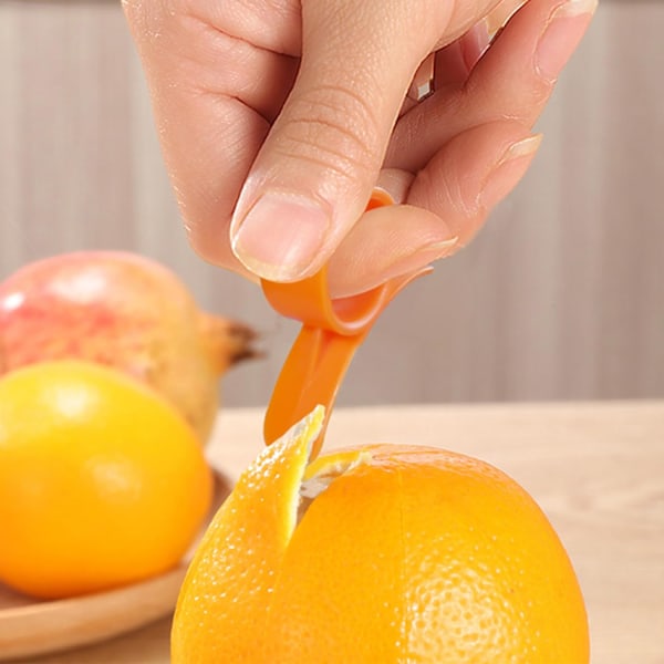 (Tilfældige farver) 2 stk. Citrus Zester Skræller, Appelsinskræller Citrusfjerner Plastikskærer Nem Frugtskærer Frugtåbner Køkkenredskab til Appelsin