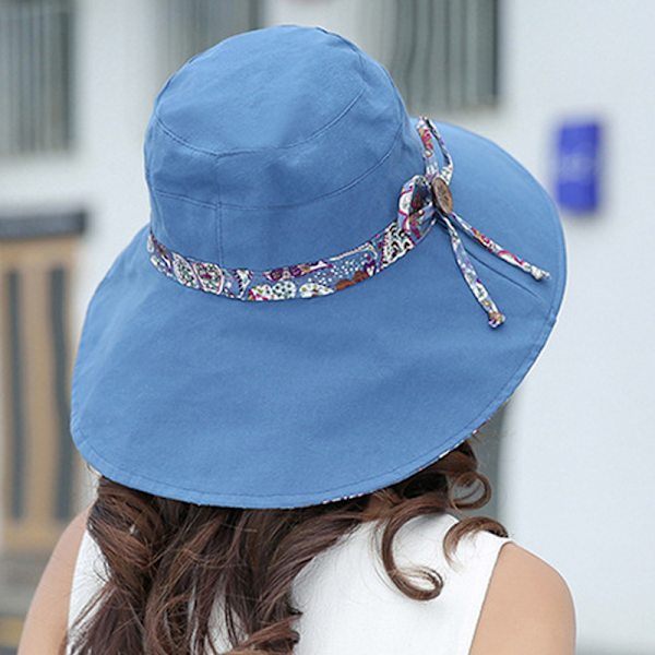 Solhatt med bred brem og treknapper for kvinner Navy