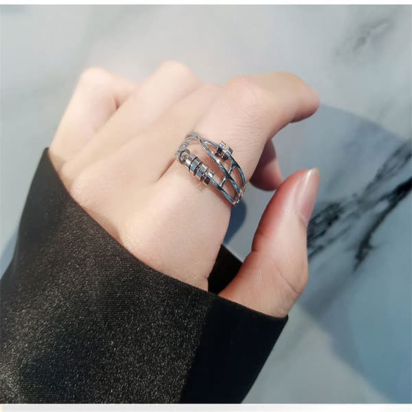 Justerbar anti-stressring med roterbare små ringe Sølv