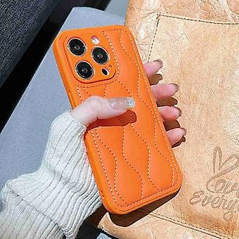 Fint hål 8-formad textur Eiderdown Airbag-telefonfodral för iPhone 15 Pro Max Orange