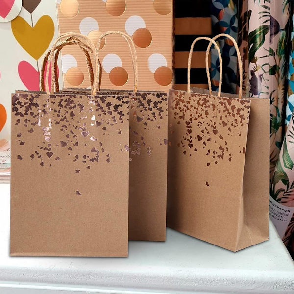 Festpåsar av papper med vacker gulddesign, kraftpapper
