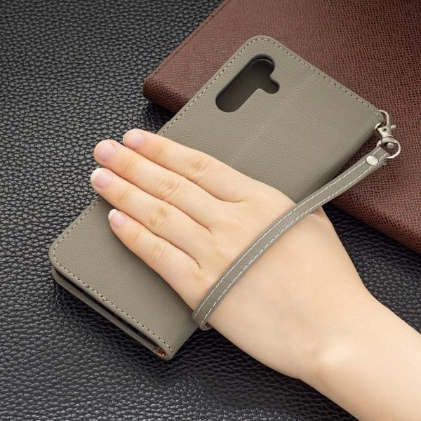 SKALO Samsung A04s 4G Premium Litchi Flip Cover - Grå Grey