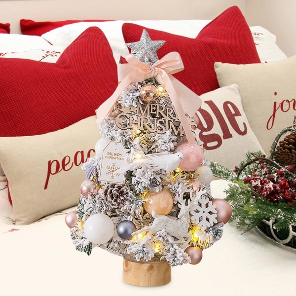 Pieni keinotekoinen joulukuusi, valaistu työpöydän joulupuu, jossa on puun latta ja koristeet joulukoristukseen (vaaleanpunainen)