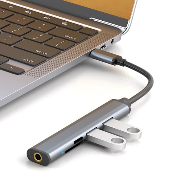 Fem-i-ett multifunktionell kortläsare expansionsdocka bärbar dator hörlurar höghastighets USB expansionsdocka (grå)