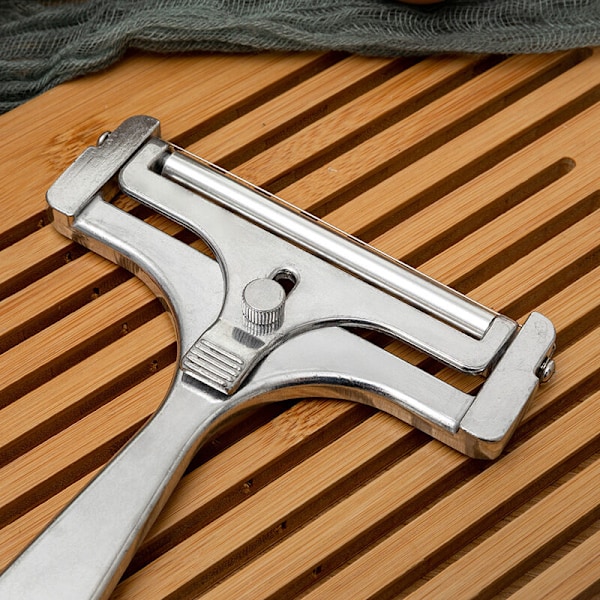 Ostskärare med spole och skärlina, variabel skärtjocklek, rostfritt stål/aluminium, rullskärning, silver