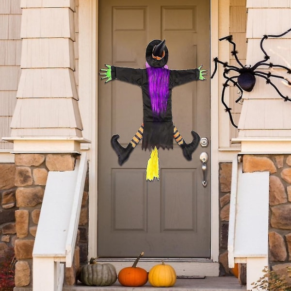 Halloween-kraschande häxa i träddekoration hängande kraschad trollkarlsornament