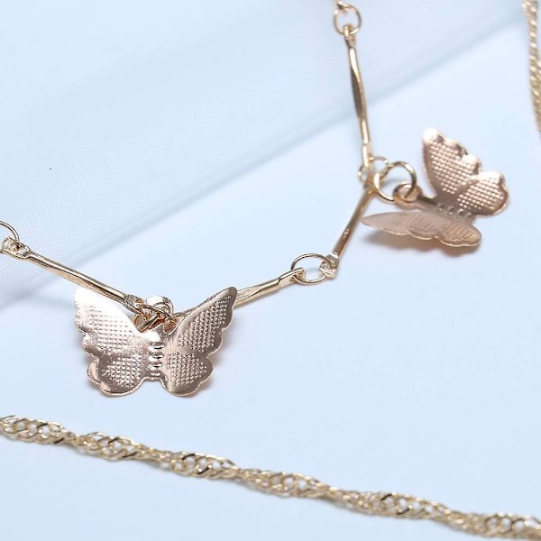 Boho flerskiktat guld halsband med ihålig fjärilshänge Fjärilshalsband Mode nyckelben kedja Smycken för kvinnor och flickor