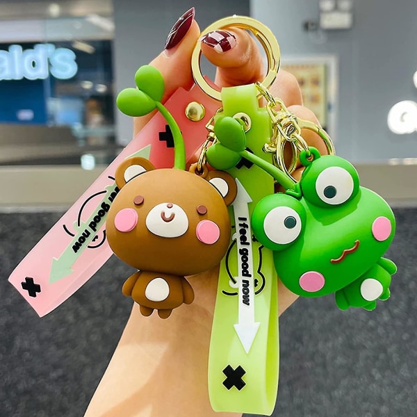 Söpö poika tyttö eläin avaimenperät itävät päässä sarjakuvaeläin laukku riipus auton avaimen riipus Kawaii reppu charmit sarjakuva