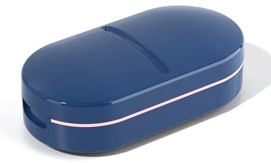 Pill splitter, V-shaped design for various pill sizes, precise cutting, compact with storage compartment, blue