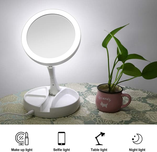 Double-sided illuminated makeup mirror, foldable, magnification from 1x to 10x, suitable for home or travel use.