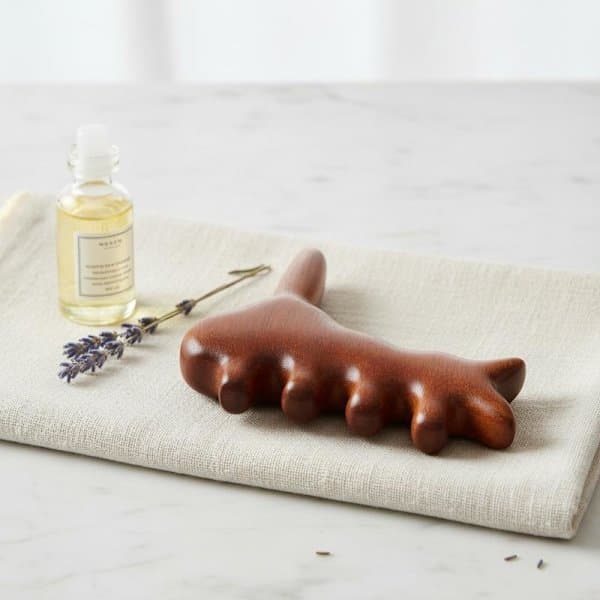 Puinen Gua Sha jalkahieroja