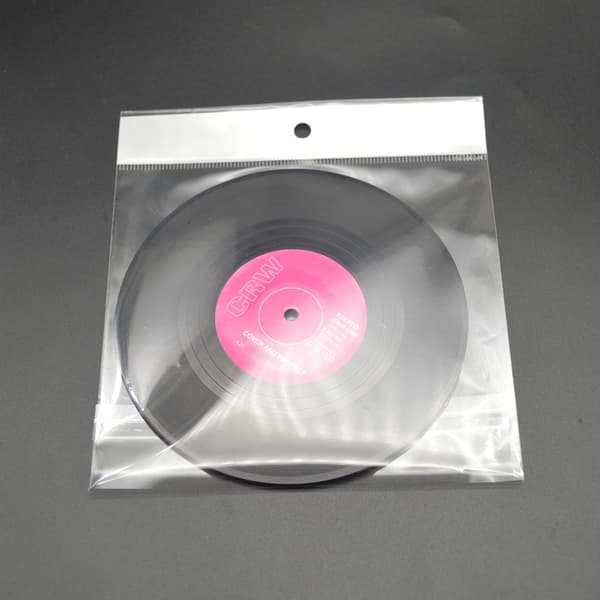 Setti, jossa 6 retro mustaa CD-lasinalusta, lasinaluset, juoma-aluset