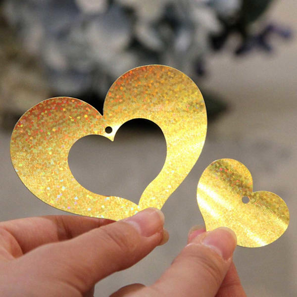 Glitterdraperi med hjerter Metallisk gull gull