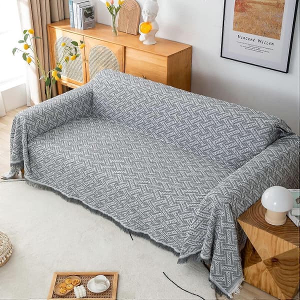 Multifunksjonelt sengeteppe eller sofateppe, grått og hvitt sammenvevd sofateppe med dusker 180 x 230 cm grå + hvit