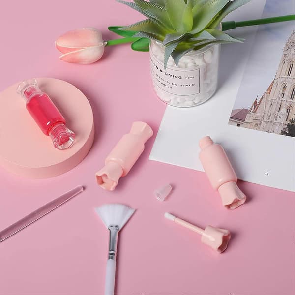 12-pakning tomme lipgloss-tuber, godteri-formede plastleppestiftbeholdere, påfyllbare, klare