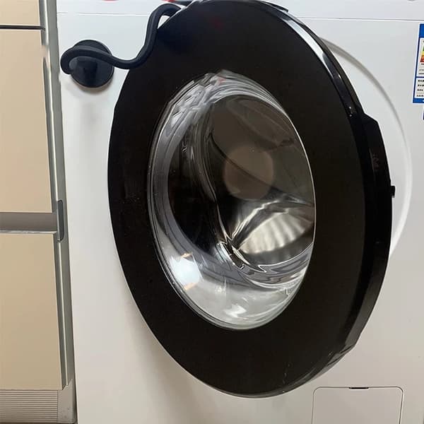 Dørholder for frontmatet vaskemaskin, magnetisk vask