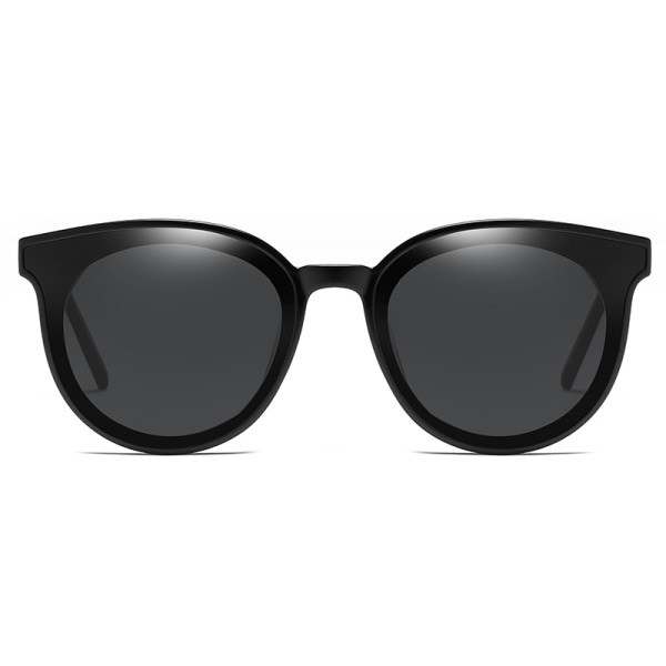 A pair of trendy retro sunglasses with a black frame and a black