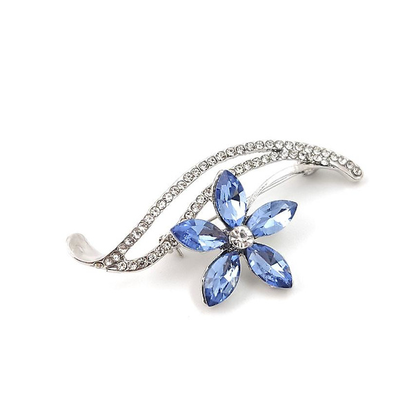 Generisk broche i sølvstål med blomstermotiv, hvide rhinsten og blå østrigske krystaller.