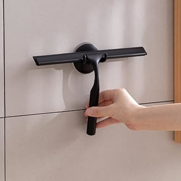 Svart. Duschsqueegee i rostfritt stål med stark sugkopp