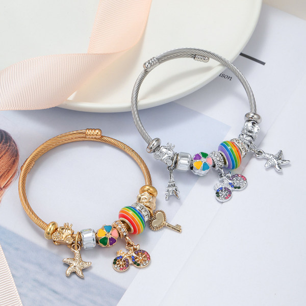 Charm bracelet in the shape of a colorful bicycle (gold, white)