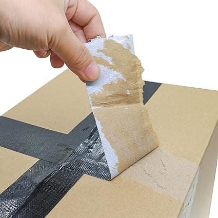 En bit orange tejp, färgad packtejp, rosa expresspacktejp