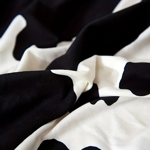 1 stk. Klassisk sort og hvidt ko-print elastisk sofabetræk, strækbart polyester spandex blanding, maskinvaskbart, universal pasform til enkelt- til firesæders
