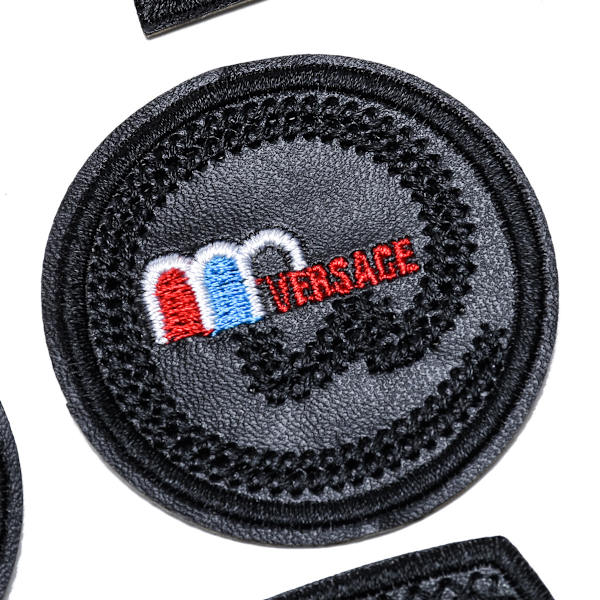 Svarta läderlappsbadges, ett set med 26