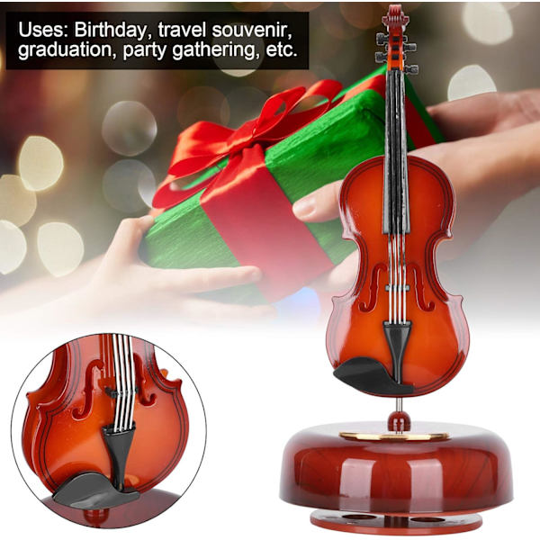 1 stycke musikbox, i form av en cello, med en roterande