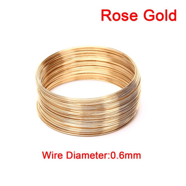 100 cirklar 0,6 mm Minnestråd i stål för pärlband Rose Gold