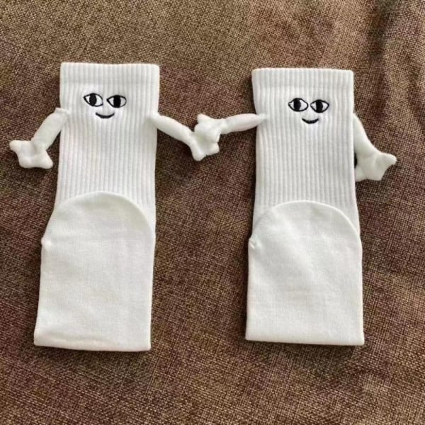 Sjovt par holder sokker i hånden Sok HVID