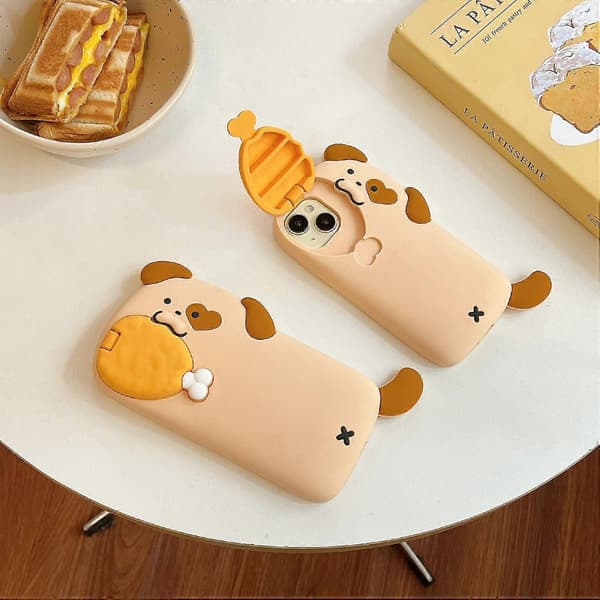 Silikoneetui til iPhone 16 Pro Max med design af hund der spiser kyllingelår, linsebeskyttelse og støttefod