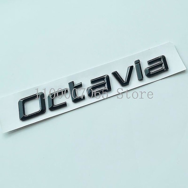 Kiiltävä musta pienet vatsalihakset kirjaimet Octavia-autotunnus Skoda Octavia -auton tavaratilan kannen nimikilven logotarra