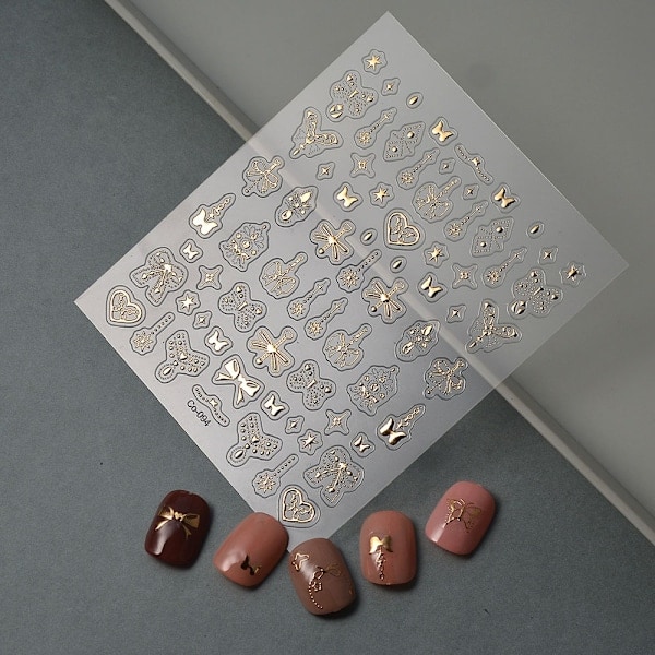 Guldpräglade nagelstickers med rosett, handmålade nagelstickers utan nagel, präglad frans, utsökt enfärgad