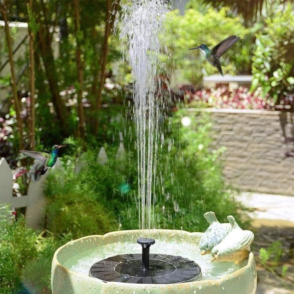 Aurinkosuihkulähde, puutarha-altaan vesiominaisuus kelluvalla pumpulla lintukylpyyn, akvaario, lampi, puutarhan sisustus ja hapen kiertovesi