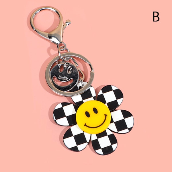 Tecknad leende ansikte guldfärg mode nyckelring för bilnycklar penna B