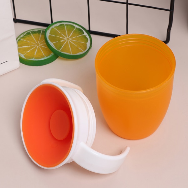 360 grader kan roteres Magic Cup Baby Learning drikkekop Orange