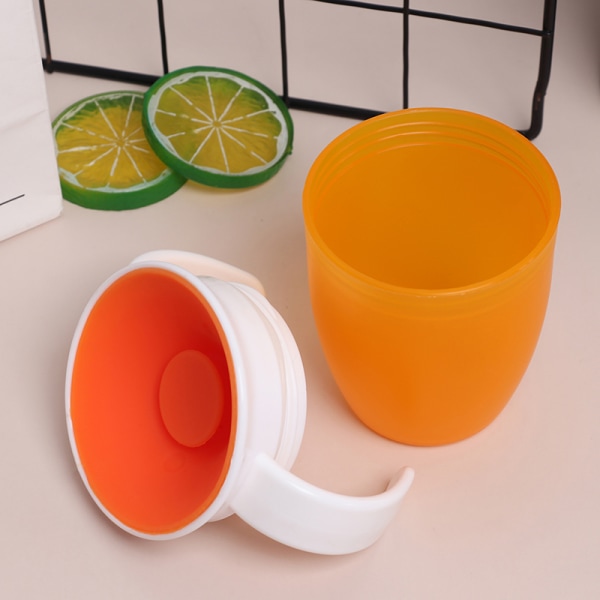 360 grader kan roteres Magic Cup Baby Learning Drikkekopp Orange