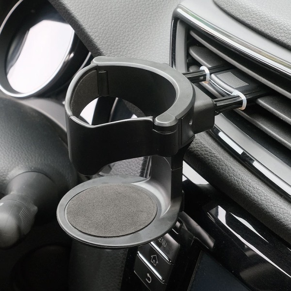 Uuden auton tuuletusaukon juomakuppipulloteline AUTO-auton vesi B