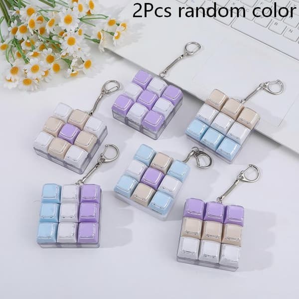 9 näppäimen mekaaninen näppäimistön avaimenperä e Luova leluavainriipus 1Pcs random