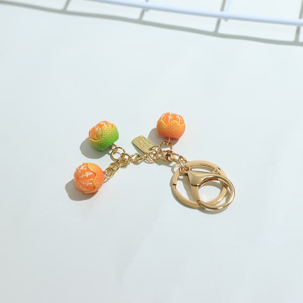 e Simulaatio 3D Orange Fruit Avaimenperä Riipus Laukku Charm Puhelin A A4