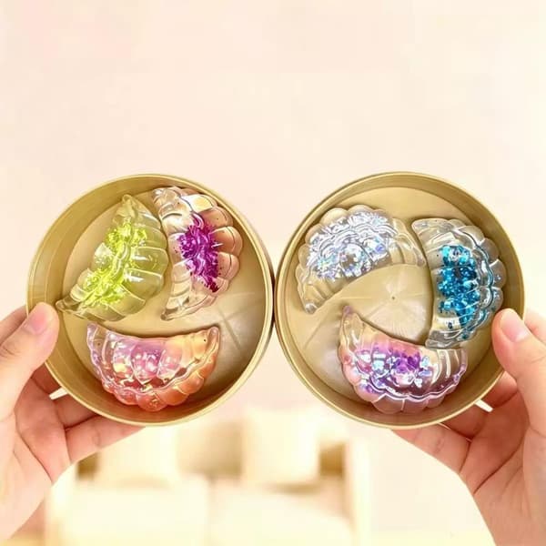 3 stk. gjennomsiktige glitter-dumplingformede fidget-leker med damp A2