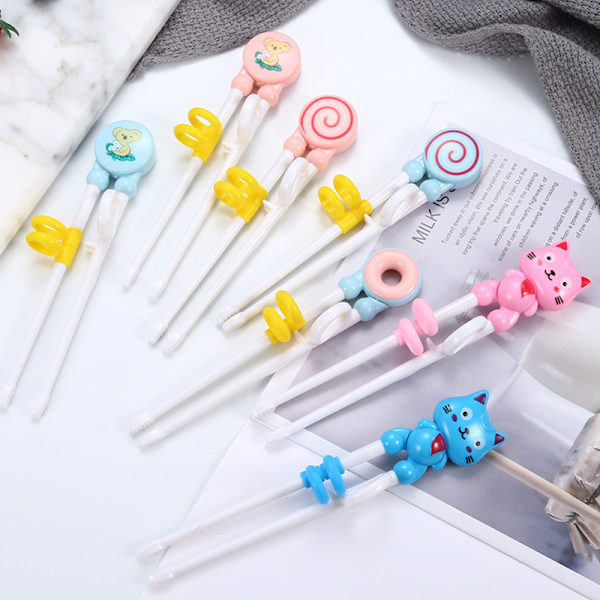 Tegneserie Barn spiser Treningspinner Baby læring servise st Pink lollipop
