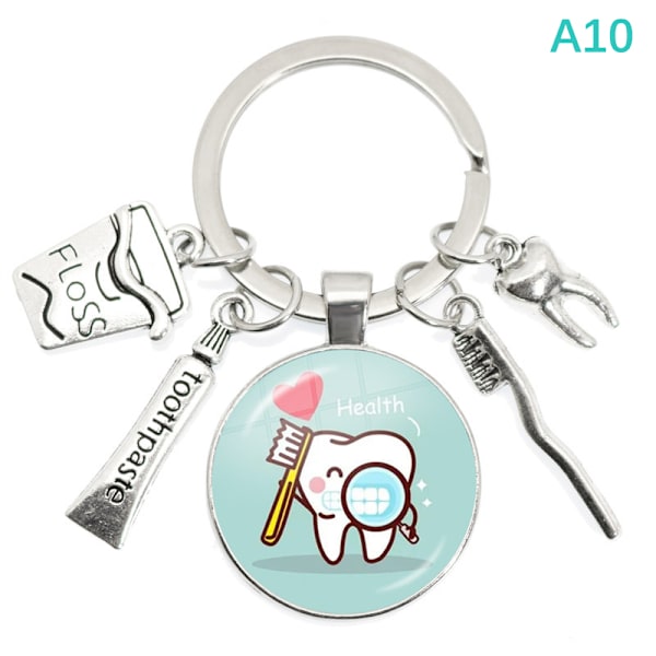 Uusi Creative e Cartoon Pattern Dentist Medal Avaimenperä Hammaslääkäri A10