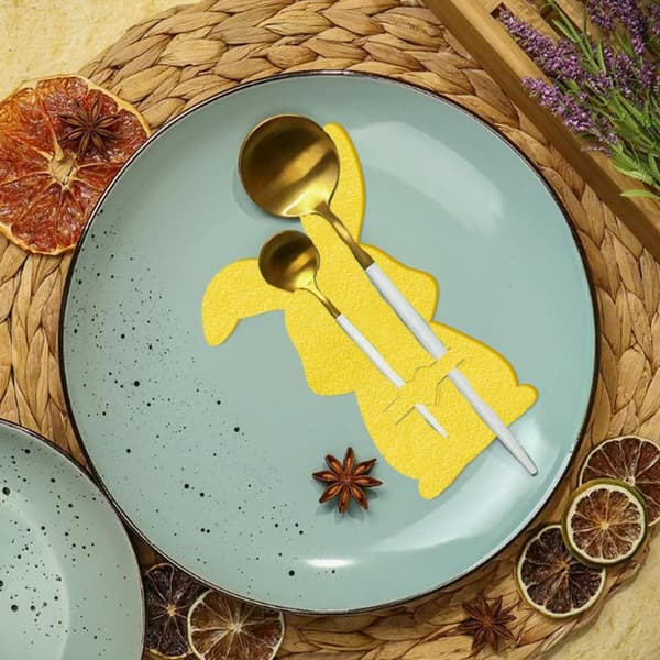 12-delars bordsunderläggsset i non-woven Yellow