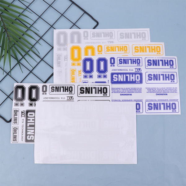 Pari läpinäkyviä OHLINS-postimerkkejä koristetarroja blue