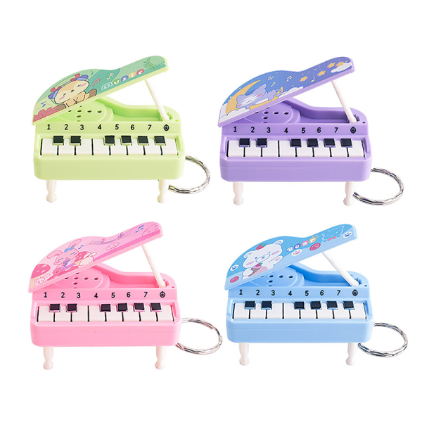 Musik elektroniskt piano Nyckelringar Minimusikaliskt instrumenterar piano Purple