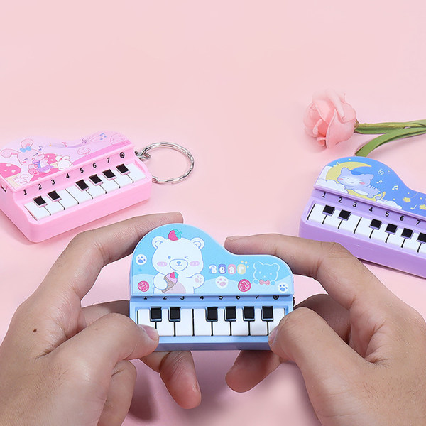 Musik elektroniskt piano Nyckelringar Minimusikaliskt instrumenterar piano Pink