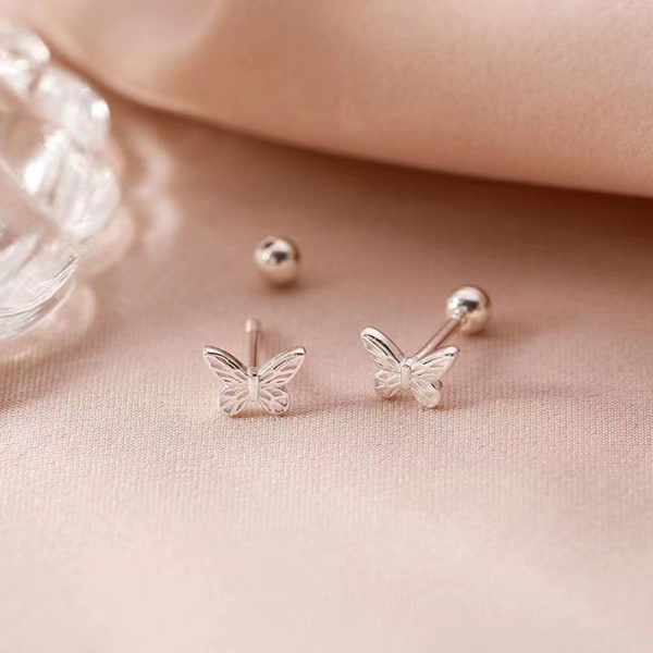 1 par ihålig bowknot öronben spik glansig fjärilsspiralstud